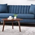 Modern stylish sofa with soft cushions in elegant living room