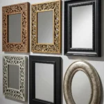 A stylish collection of decorative wall mirrors featuring intricately carved wooden, ornate resin, sleek black, and vintage oval frames displayed against a neutral wall.