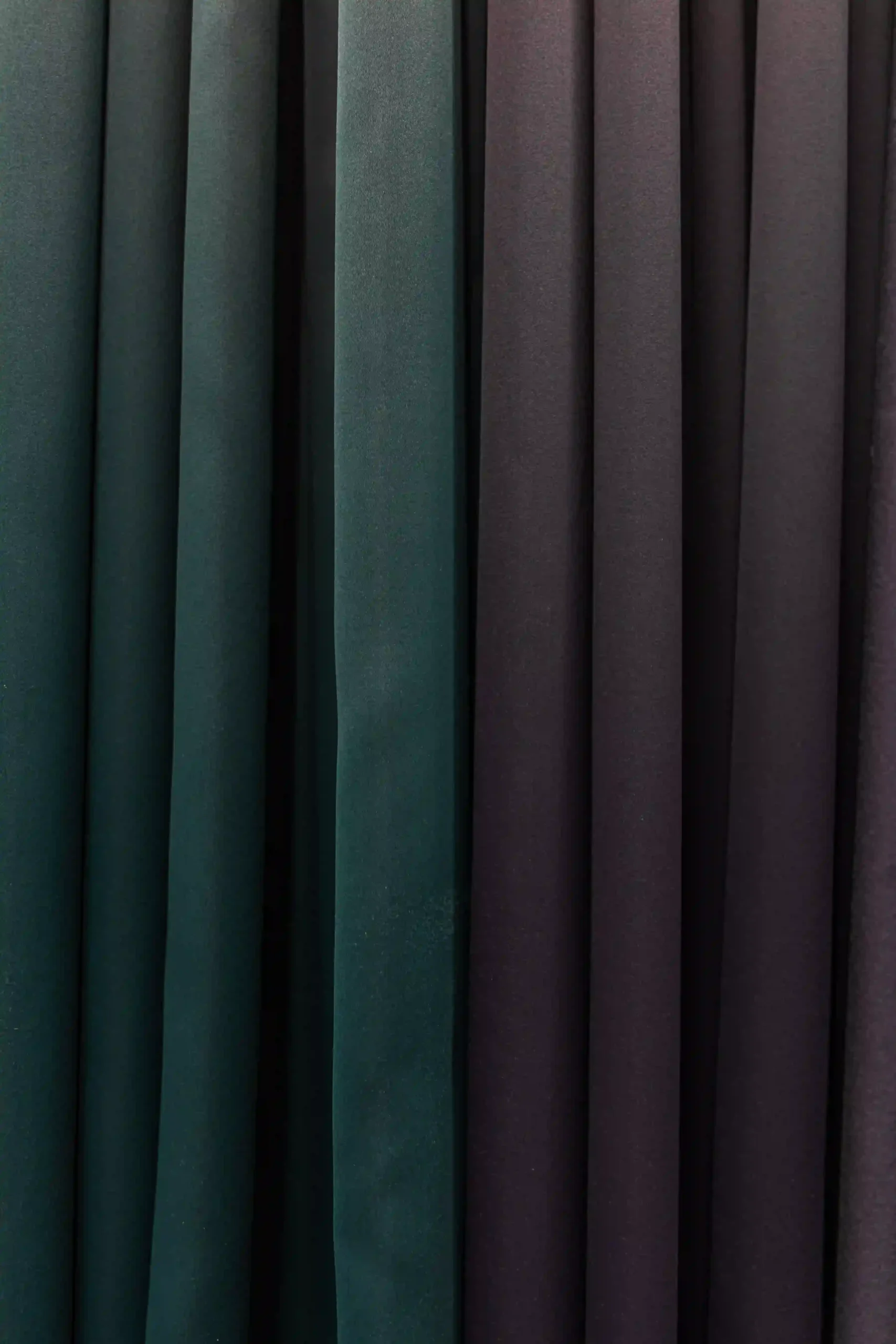 Long curtains touching the floor in a stylish bedroom interior