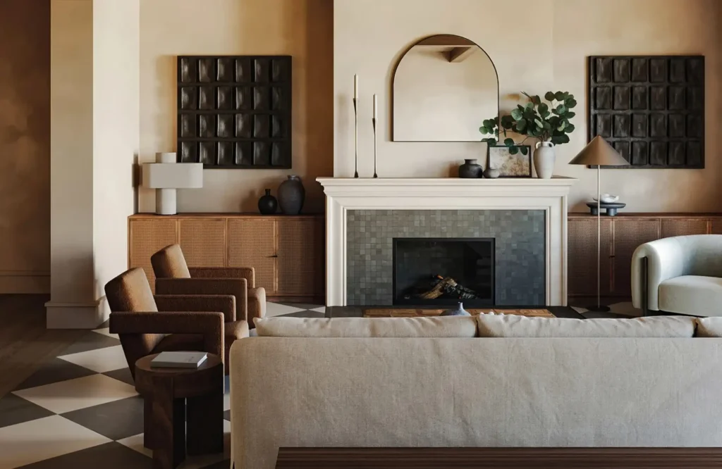 A warm, stylish living room with an arched mirror above the fireplace, enhancing depth and elegance.