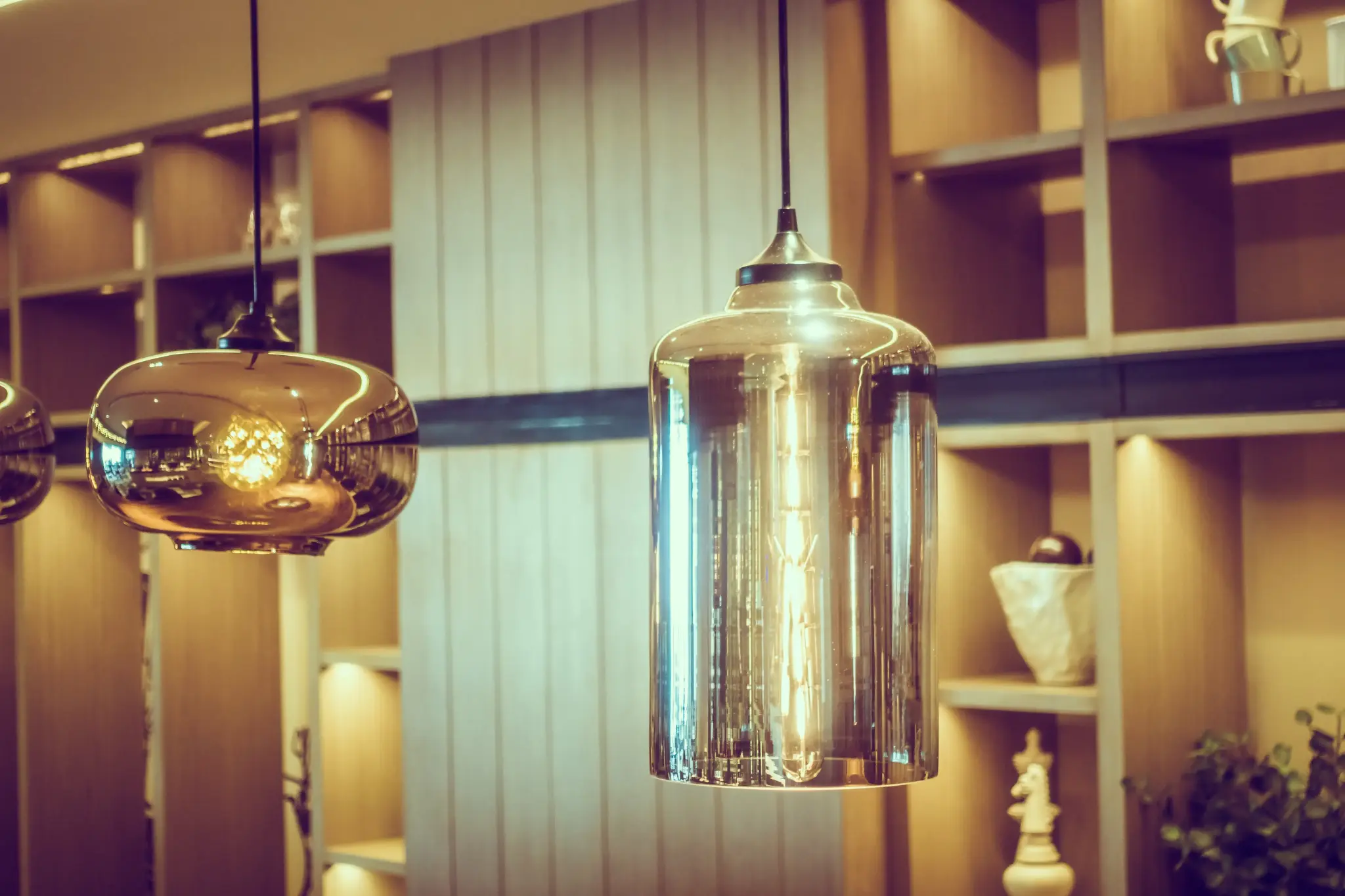 Modern kitchen lighting with stylish pendant lights, recessed ceiling lights, LED under-cabinet lighting, and a clean contemporary interior design.